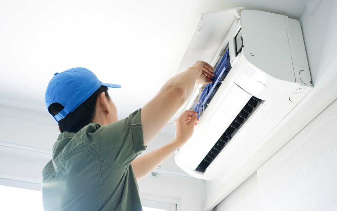 HVAC technician servicing a ductless mini split in Sacramento