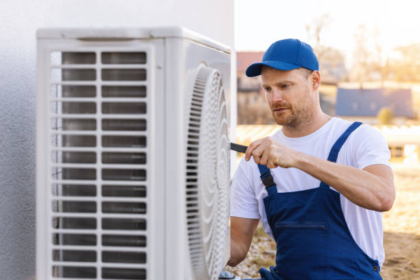 HVAC technician servicing an outdoor air conditioner in Sacramento