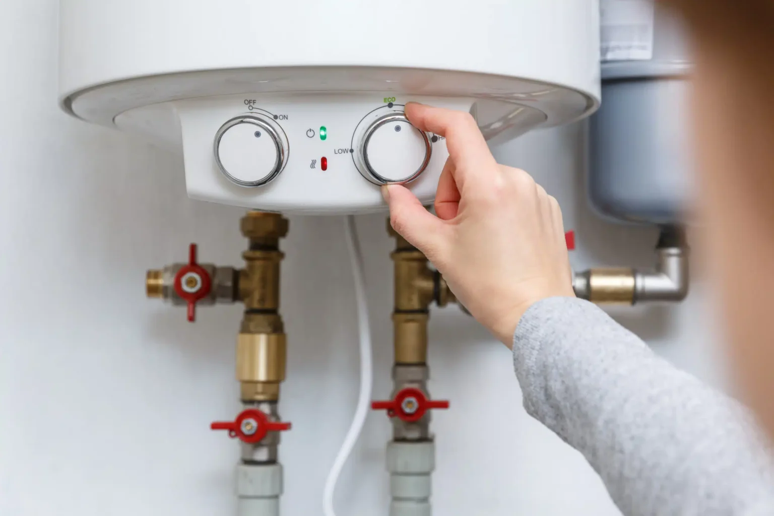 Technician adjusting a water heater in Sacramento